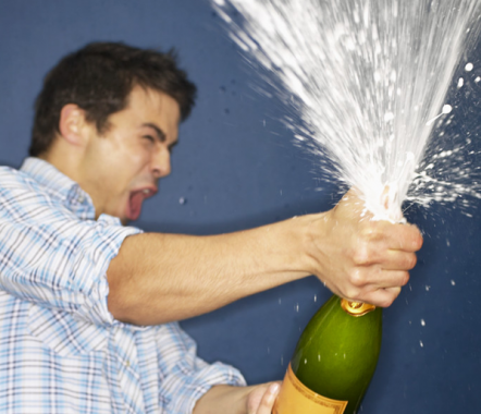 Man popping champagne cork