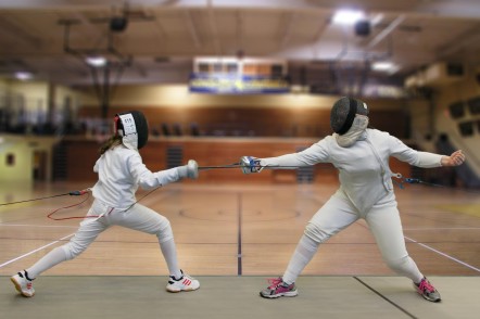 Two women fencing